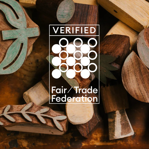 Wooden stamps with a Verified Fair Trade Federation logo in the center.